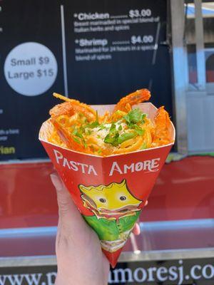 Linguine vodka with shrimp in a pasta cone