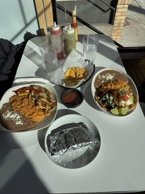Enchiladas, tacos, chips and salsa.