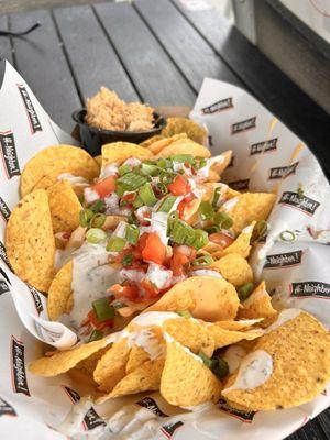 Nachos with chicken on the side