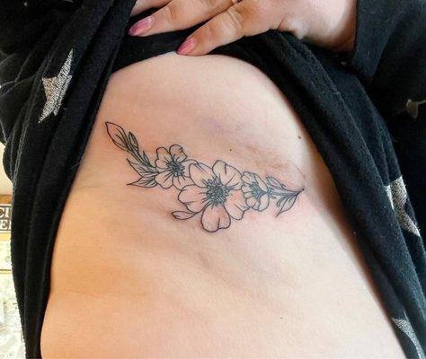Floral underboob tattoo