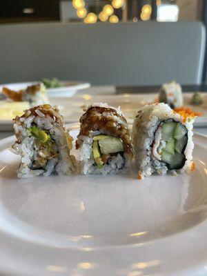 The three sushi rolls I ordered - L to R - shrimp tempura roll with cream cheese, eel roll, rainbow roll (tune sliver on top removed).