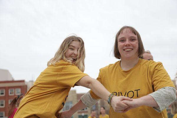 Having fun supporting one another in dance.