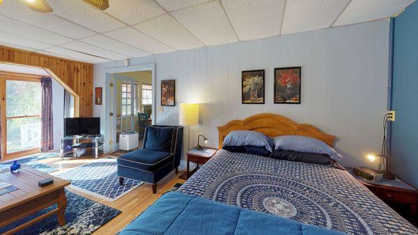 Living and sleep area with wall to ceiling windows.  Great for your dogs to look out of.