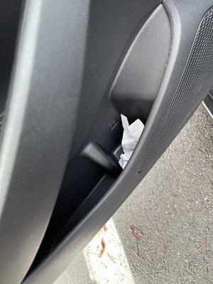 Crumpled receipts in all doors and the middle divider.