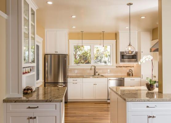 The sink, stove, and fridge are strategically placed to optimize movement for the chef!