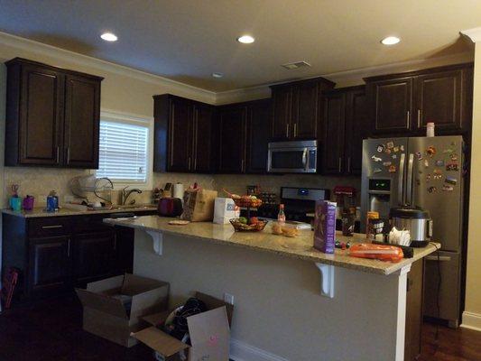 Bottom cabinets were matched by the designer and they were installed. The granite was put in by a third party vendor.