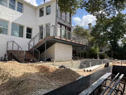 Structural steel and wood framed rear balcony/deck engineering for a custom home remodel in Austin, TX.