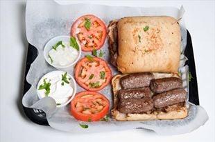 Chevapi-unique all beef logs in ciabatta roll! Delicious!
