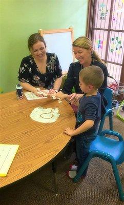 Speech Pathologist, Molly, working with a client on vowel sounds