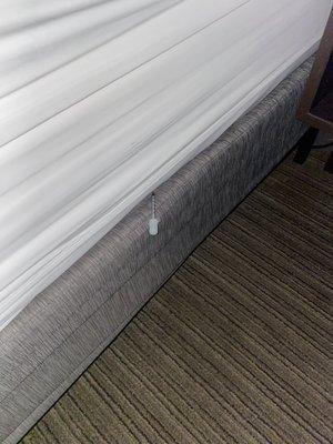 Needle tucked into bed sheets