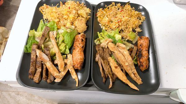 Platers with chicken briani, grill steak, grill chicken, shish kebabs.