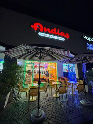 Night view of the colorful Andias storefront Hialeah.