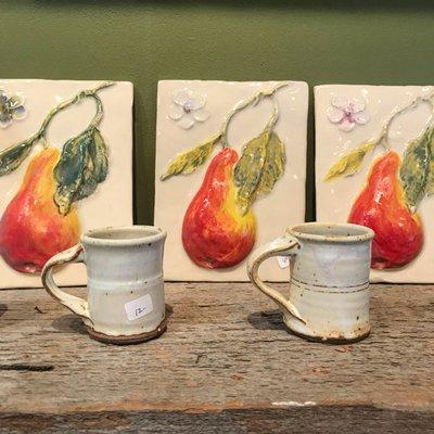 Bas relief sculpted and glazed art tiles by gallery member-owner Kim Walker and tableware by Charlie Grosjean at SevenArts in Ellsworth.