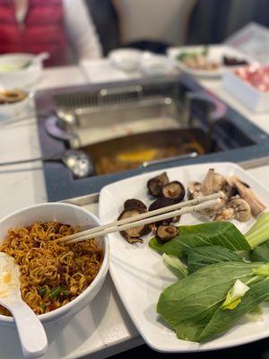 My mushrooms and bok Choy with some cooked instant noodles and the broths.