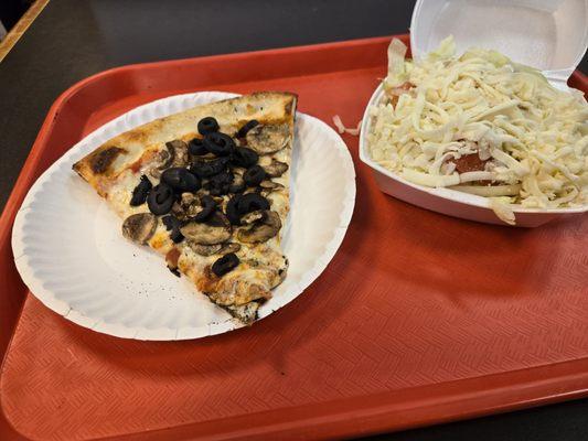 Pizza with black olives and mushrooms with a side salad