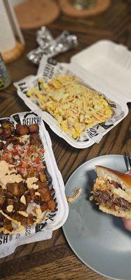 Colombian salchipapa, maicitos, and a burger.