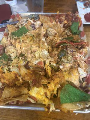 Great food! But if you're planning on getting the nachos for an appetizer you definitely won't be finishing them! Huge portion size!