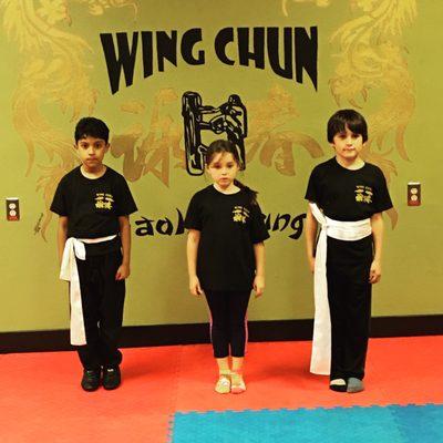 Students receive their white belts.