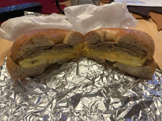 Turkey sausage, scrambled eggs, and cheese on a whole wheat bagel