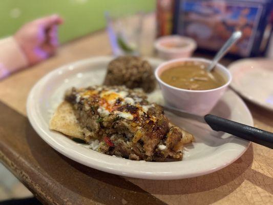 Boudain stuffed catfish with dirty rice and gumbo