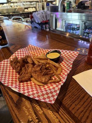 Chicken Tenders with fries and Coleslaw.