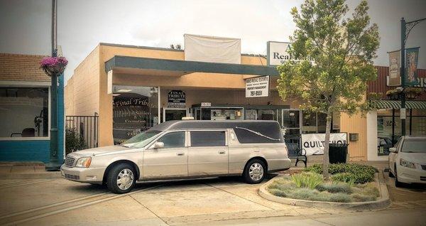 The main entrance and elegant hearse at Final Tribute.
