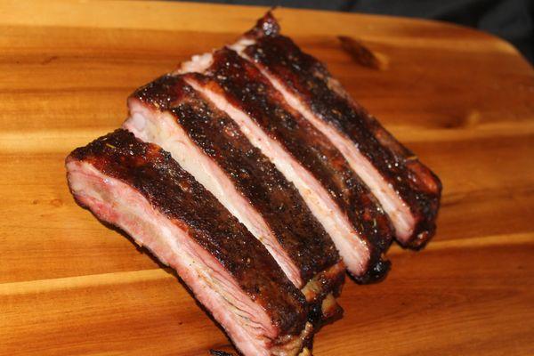 Ribs are the reason napkins were invented. Smoked low, BBQ glazed, and dripping with flavor!
