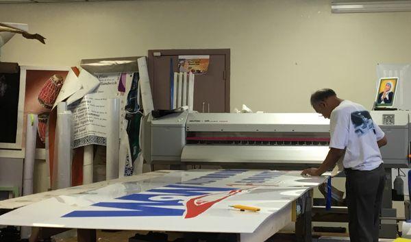 My workshop while printing a large format print sign.