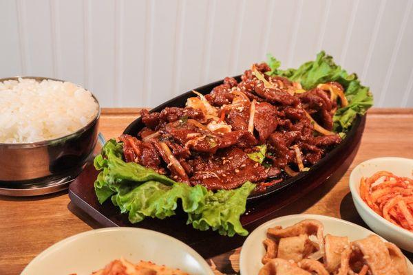 Spicy pork bulgogi with homemade Korean sides and white rice.