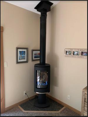 Jotul GF 370 3 sided gas fireplace with remote in master br. Very professional installation through roof with new chimney, well done!