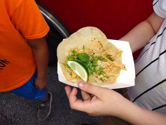 Chicken taco from the food truck. This was salty. My child asked for no onions no salsa, which is why it's bare.