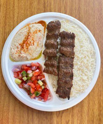 Our delicious Lule kabab plate with side of hummus and shirazi