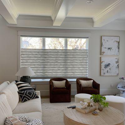 Top-down-bottom-up Vignette Roman Shades bring full light in across the ceiling while filtering soft light through the soft folds