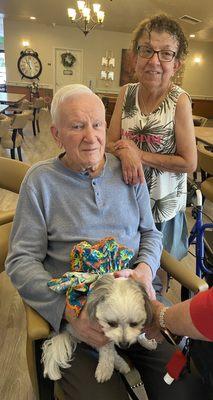 My dad/ enjoying the therapy dogs.