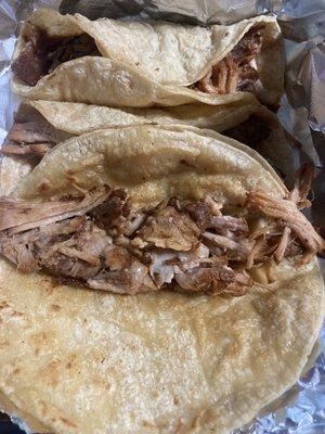 Carnitas tacos. It comes with a side dish of cilantro, onions, and chopped tomatoes. The carnitas were fantastic. Highly recommend.