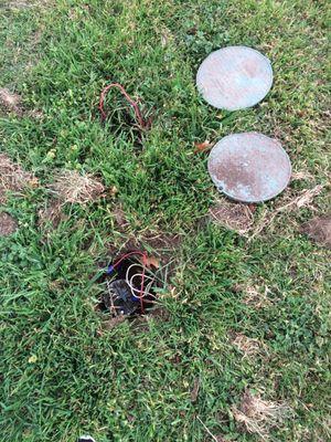 Exposed wiring in yard.