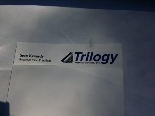 Trilogy logo w/ name Sean Kennedy, RVP