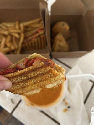 Close up of sandwich that I dipped in butter chicken sauce