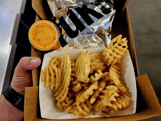 David Chang's chain sweet-spicy chicken sandwich and side of jalapeno dip waffle fries.