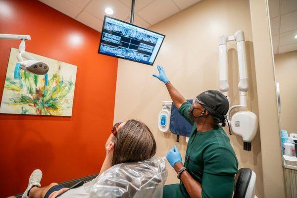 Dental implant and crown consultation using digital X-rays at 10 Day Smiles, Arlington TX.