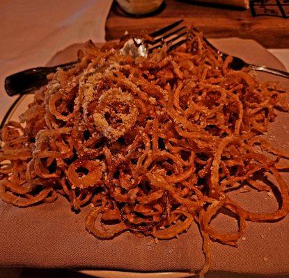 Amazing Crispy Onions served with warm bbq sauce