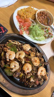 Parriada Plate Which is pretty much a Fajita Plate with Shrimp,Chicken and Steak with bell pepper and onion.