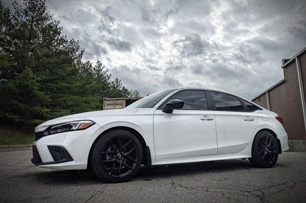 Carbon based 20% tint with a windshield strip.