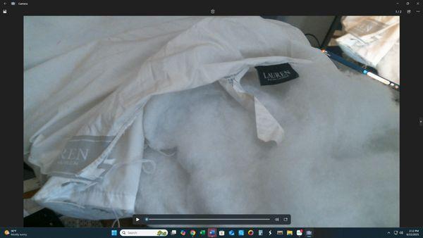 This is the flat folded polyester batting inside the pillow that is balled up and cannot be straightened out.