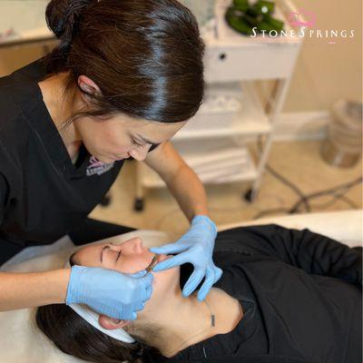 Nurse Katie performs Dermaplaning to remove fine wrinkles and deep acne scarring at Stone Springs MedSpa by LMG.