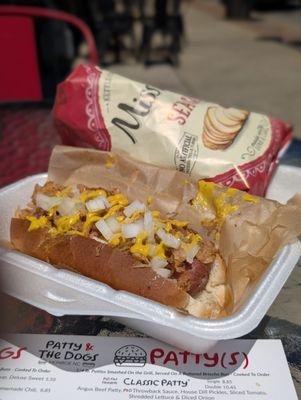 Grilled 1/6 pound beef dog with sauerkraut, onion, and yellow mustard. Mmmmm