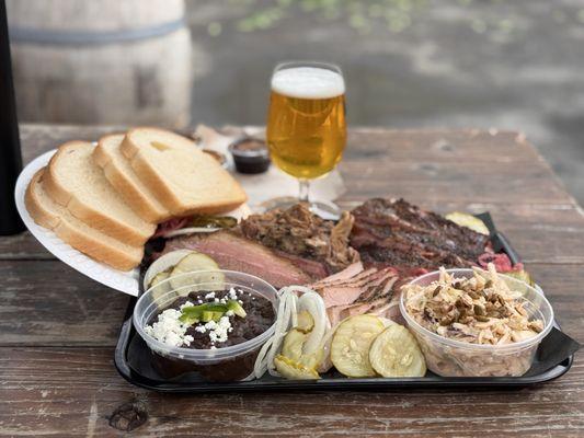An assortment of the 1/2 lb meats, beans, and coleslaw. Plus a delicious Fort George IPA from Play.