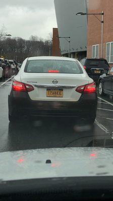This Car cut me off, nearly hit two women and blew a stop sign picking up two students at the school!