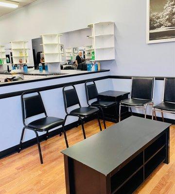 Waiting area, barber chairs just out of sight.