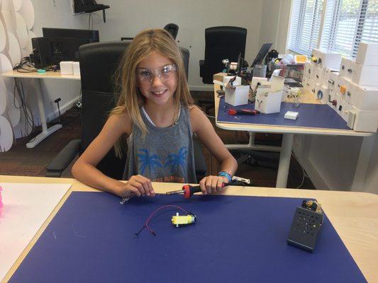 Student building a robot